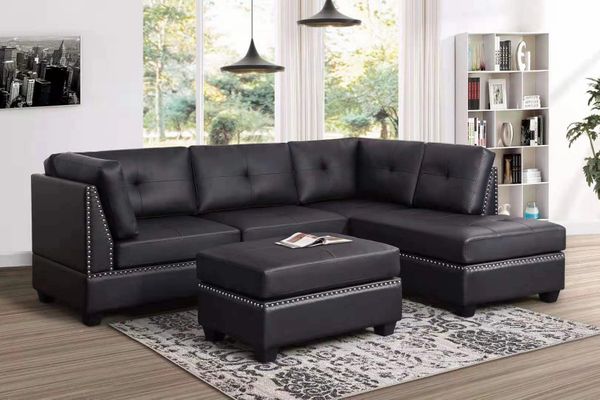 #2898 BLACK SECTIONAL & STORAGE OTTOMAN WITH NAIL HEAD TRIM